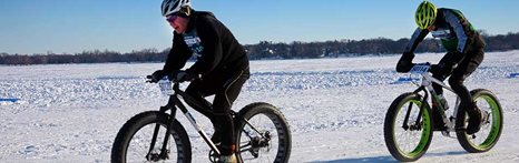cyclist riding on snow