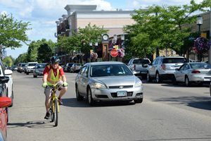 Downtown Robbinsdale, West Broadway Avenue. Bicyclists and cars can easily share wider travel lanes.
