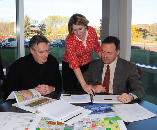 Council staff Sector Representatives provide professional planning and technical assistance to communities.  Pictured here is sector rep Patrick Boylan (right) with Apple Valley planners Tom Lovelace and Margaret Dykes.