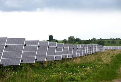 Rows of solar panels in a field.