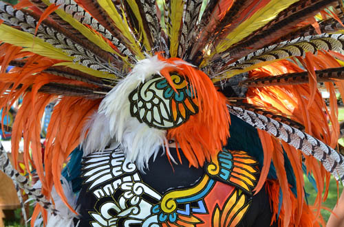 Colors on the costume of a Kalpulli Ketzal Coatlicue dancer are reminiscent of a monarch butterfly.