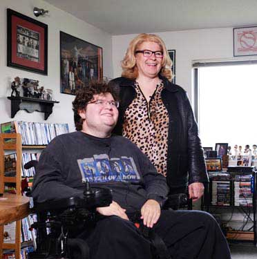 Chris Buhl with his aunt, Marilyn Parker, in his Brooklyn Park apartment.