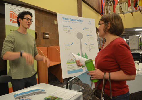 Council water supply intern Max Grossman talks with a resident at the water forum in White Bear Lake. Council water supply intern Max Grossman talks with a resident at the water forum in White Bear Lake.