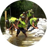 People laying out sandbags