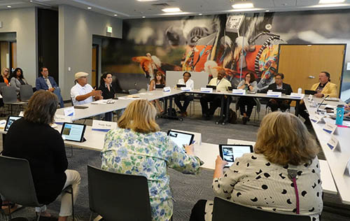 People around a table at a council meeting.