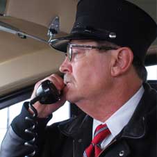 photo of a Northstar rail conductor speaking into a phone