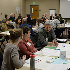 People working together at tables.