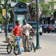 Two boys on bicycles in downtown Robbinsdale.