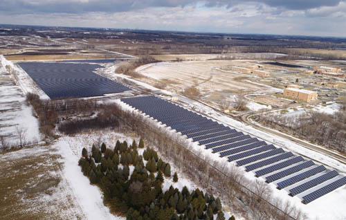 A large array of solar collectors spreads out over a snowbound field at the Metropolitan Council-owned Empire Wastewater Treatment Plant in central Dakota County.