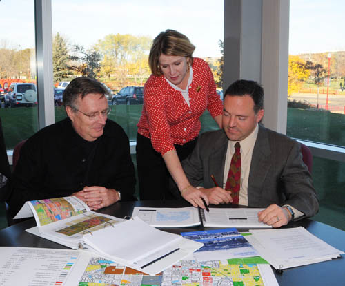 Council staff Sector Representatives provide professional planning and technical assistance to communities. Pictured here is sector rep Patrick Boylan (right) with Apple Valley planners Tom Lovelace and Margaret Dykes. Council staff Sector Representatives provide professional planning and technical assistance to communities. Pictured here is sector rep Patrick Boylan (right) with Apple Valley planners Tom Lovelace and Margaret Dykes.