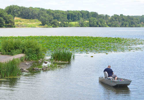 The city has abundant parks and natural areas. Shown here is a channel of the Mississippi River and, on the far shore, the city’s Mississippi Dunes Golf Links.