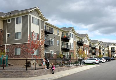 Three-story apartment building.