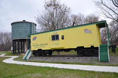 The Carver Water Tower in downtown Carver’s Depot Park was built in 1900. It provided water for steam locomotives that traveled through town. Also pictured is an historic caboose in the park.