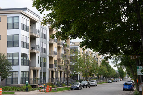 A row of four-story apartment buildings.