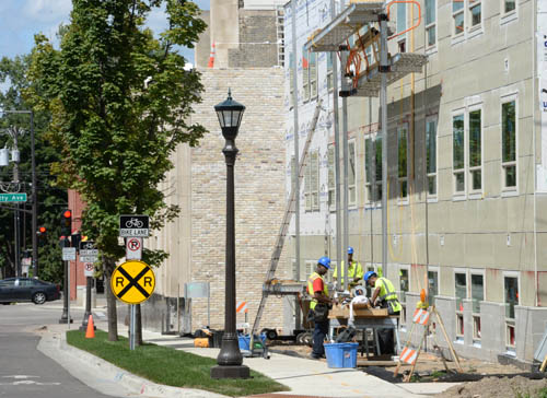 The TLC Land Bank provided funds for the acquisition of the Old Home Dairy site, which has been transformed into Western U Plaza, with 62 units of affordable housing included at the site. Shown here is construction under way in August 2015.