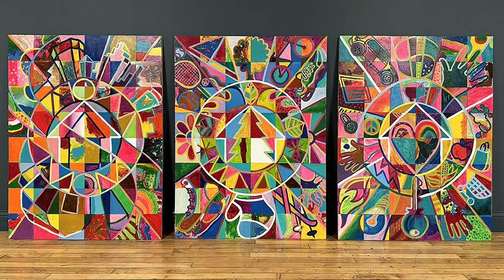 Three large, brightly colored visual panels made of square tiles painted by residents who attended one of the Art+Policy events.