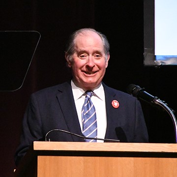 Chair Zelle speaking at a podium.