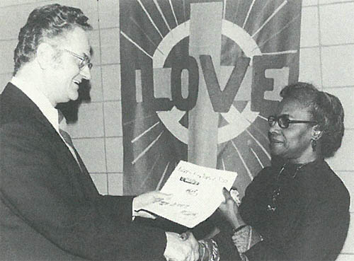 Dr. George E. Whetstone, left congratulates Janabelle Taylor as the incoming president of the Saint Paul Area Council of Churches at the Fall Assembly in November 1972. Taylor was the first woman and the first African American to serve as the Council’s president. Her term of office was from 1973 to 1975. (Photo and caption courtesy SPACC – now Interfaith Action of Greater Saint Paul – from a book published for the 100th anniversary of SPACC in 2006.)