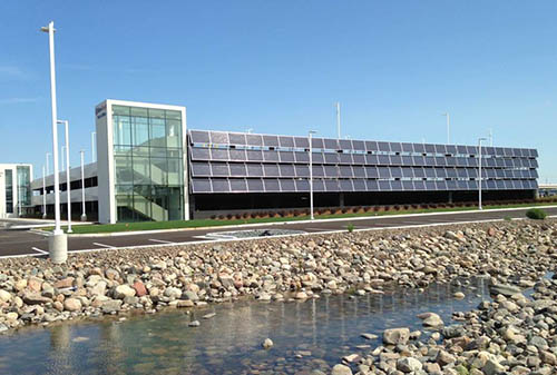 Rows of solar panels on a park-and-ride ramp.