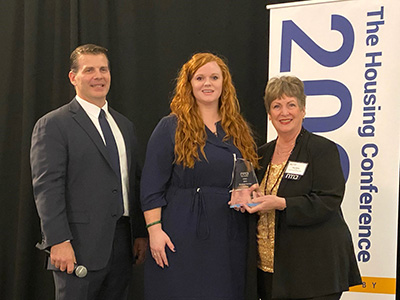 A woman receiving an award.