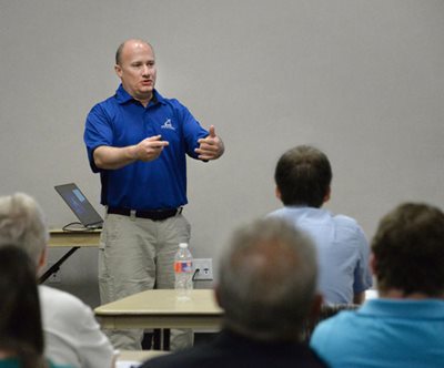 Housing inspector Joseph Kummer talks to landlords about proper upkeep of rental properties.