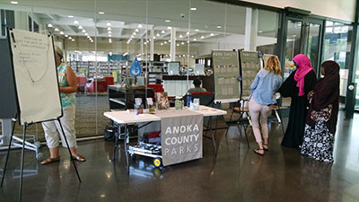 Tables and posters asking for input on park features.