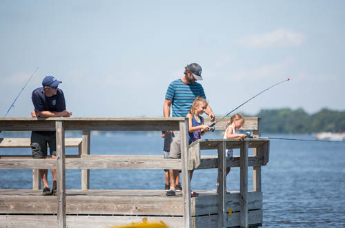 Families enjoy fishing off a pier at Cedar Lake Farm Regional Park. Photos courtesy Three Rivers Park District.
