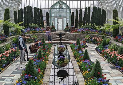 People walking through the conservatory's sunken garden.