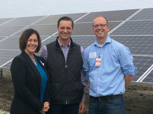Metropolitan Council Member Deb Barber, Council Chair Adam Duininck (center) and Shakopee Mayor Brad Tabke at the solar installation outside the Council’s Blue Lake Wastewater Treatment Plant in Shakopee.