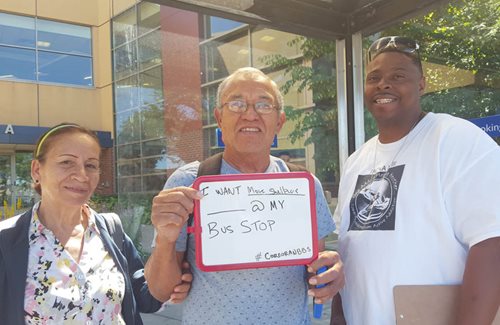 Marvin Applewhite (right) with residents he engaged about how to improve bus stops and where to put shelters.