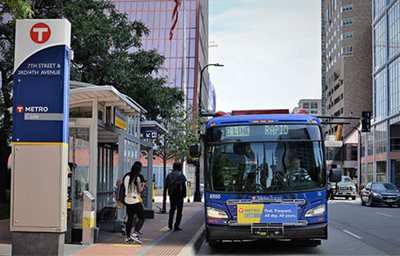 Passengers boarding a C Line bus in downtown Minneapolis.