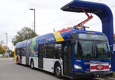 An electric bus at a charging station.