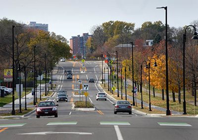 A road with single lanes going each way and a median with turn lanes.