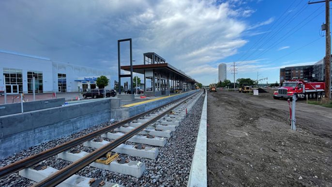 Track work in progress near a light rail station.