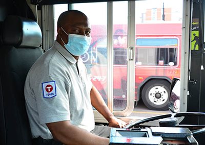 A Metro Transit driver wearing a mask.