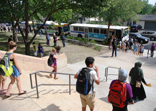 Students board buses at Southwest High School in Minneapolis.