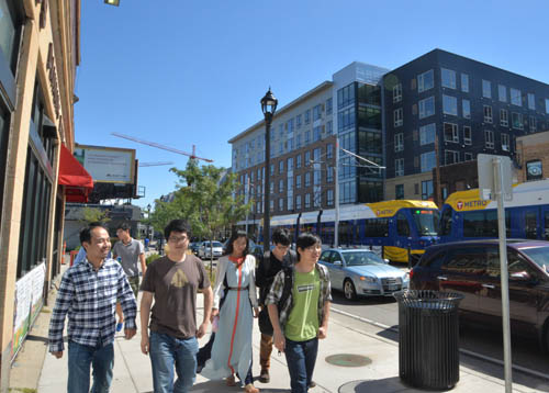 Stadium Village Flats (center) provides 125 units of student housing above retail, just two blocks from the Green Line’s Stadium Village Station.