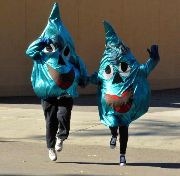People wearing water drop costumes
