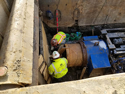 Two workers on a construction site.