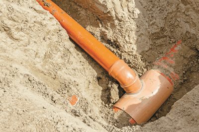 An orange pipe connected to another orange pipe.