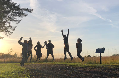 Five people jumping.