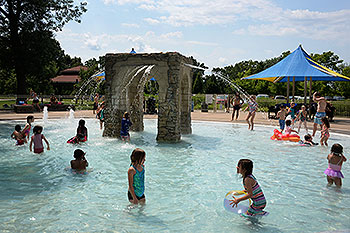 Children swimming at a pool.