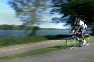 A person riding a bike, with a blurred background.