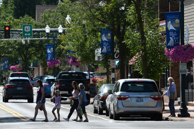 Pedestrians crossing a downtown street.