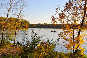 Two people canoeing on Cedar Lake in Minneapolis.