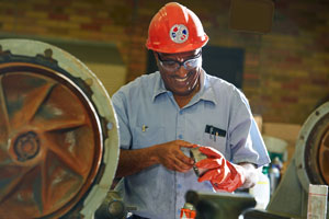 Employees assess a system at the Metro Plant.