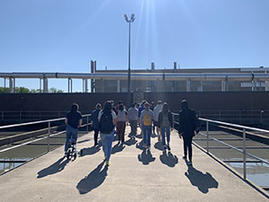 A group of interns on a tour of a wastewater treatment plant.