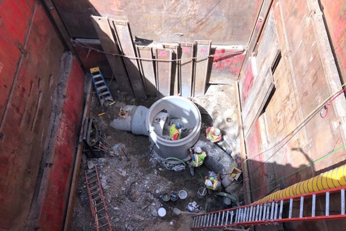 Workers repair a collapsed section of regional sanitary sewer in Brooklyn Park.