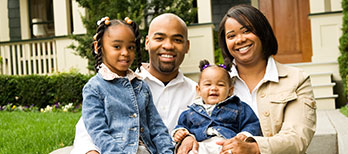 Family in front of house