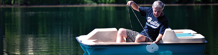 Man In Paddle Boat